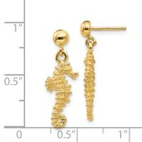 Pair of gold seahorse dangle earrings with textured finishes, shown next to a ruler measuring approximately one inch in length.