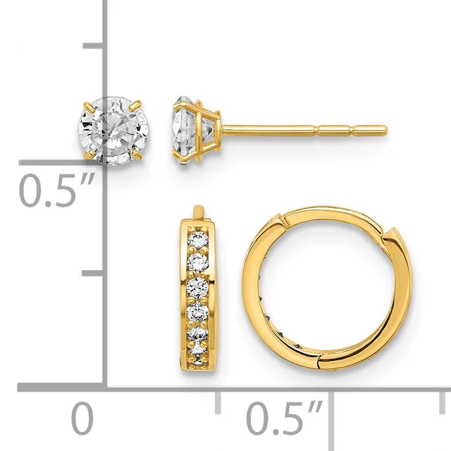 Two pairs of gold earrings displayed on a measurement scale: stud earrings with round clear stones and a hinged hoop pair with channel-set clear stones.