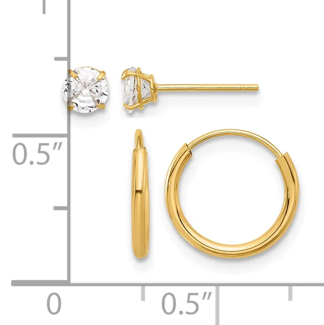 Two pairs of gold earrings displayed against a measurement scale: stud earrings with round clear stones in four-prong settings, and polished gold hoop earrings.