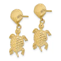 A pair of gold shell-shaped stud earrings with dangling sea turtle charms featuring textured details.