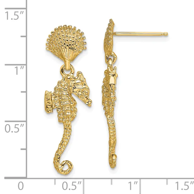 Gold seahorse dangle earrings with textured fan-shaped tops and post backs, shown next to a measurement ruler indicating approximately 1.25 inches in length.