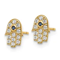 A pair of gold hamsa hand stud earrings set with white cubic zirconia stones and small blue sapphires in the center, shown against a white background.