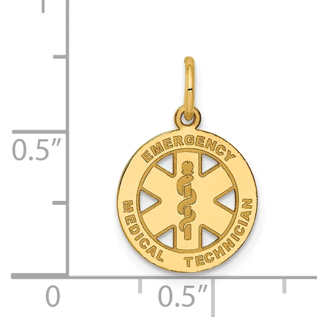 Gold circular medical alert pendant with "Emergency Medical Technician" text around the rim and a caduceus symbol in the center, shown next to a ruler for scale.