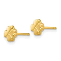 A pair of small gold four-petal flower stud earrings with textured petals and straight posts, shown from the front.