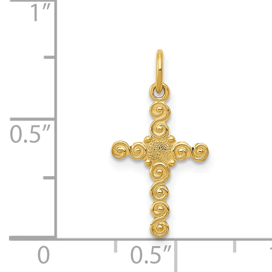 Gold cross pendant with spiral bead details at each end, shown next to a ruler indicating approximately one inch in height.