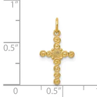 Gold cross pendant with spiral bead details at each end, shown next to a ruler indicating approximately one inch in height.