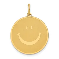 Gold circular pendant with a smiley face design featuring two dots for eyes and a curved smile, suspended from a gold bail loop.