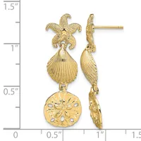 Gold-toned starfish and shell dangle earrings with sand dollar charm, displayed against a measurement scale showing approximately 1.5 inches in length.