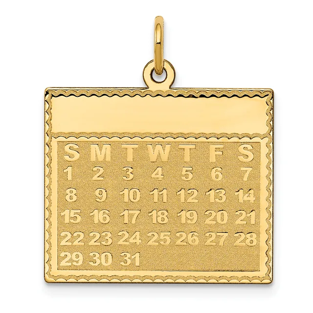 Gold calendar pendant with a decorative scalloped border, displaying all days of the month arranged in rows with day-of-week abbreviations at the top.