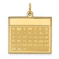 Gold calendar pendant with a decorative scalloped border, displaying all days of the month arranged in rows with day-of-week abbreviations at the top.