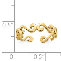 Gold-toned decorative cuff bracelet with scrolling wave-like designs, shown against a measurement scale indicating approximately 0.5 inches in height and width.