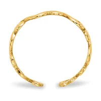 A polished gold cuff bracelet with a textured bamboo-style segmented design, shown open against a white background.