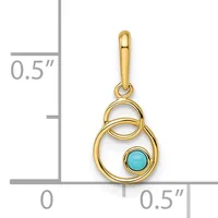 Gold pendant with intertwined circular loops and a turquoise cabochon stone, shown against a measurement scale indicating approximately 0.5 inches in width and height.