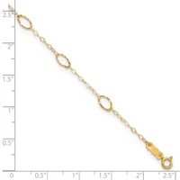 Gold-toned chain bracelet with three textured oval links spaced along its length, displayed against a ruler showing approximately 2.5 inches total length.