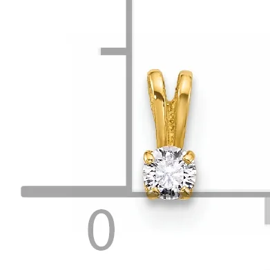 A gold pendant featuring a round clear gemstone in a four-prong setting with a split bail on top, displayed against a measurement scale.