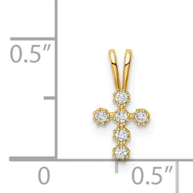 Gold cross pendant with round diamonds arranged in a cross pattern, shown against a ruler for scale indicating approximately half an inch in width and height.