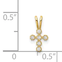 Gold cross pendant with round diamonds arranged in a cross pattern, shown against a ruler for scale indicating approximately half an inch in width and height.