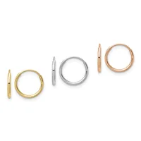 Three pairs of polished hoop earrings displayed in a row: yellow gold, white gold, and rose gold finishes.