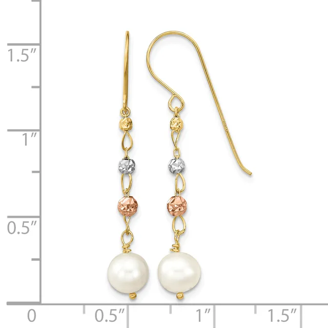 Gold fishhook earrings with white pearl drops, small rose gold and silver tone beads, and gold chain links, shown against a measurement ruler.