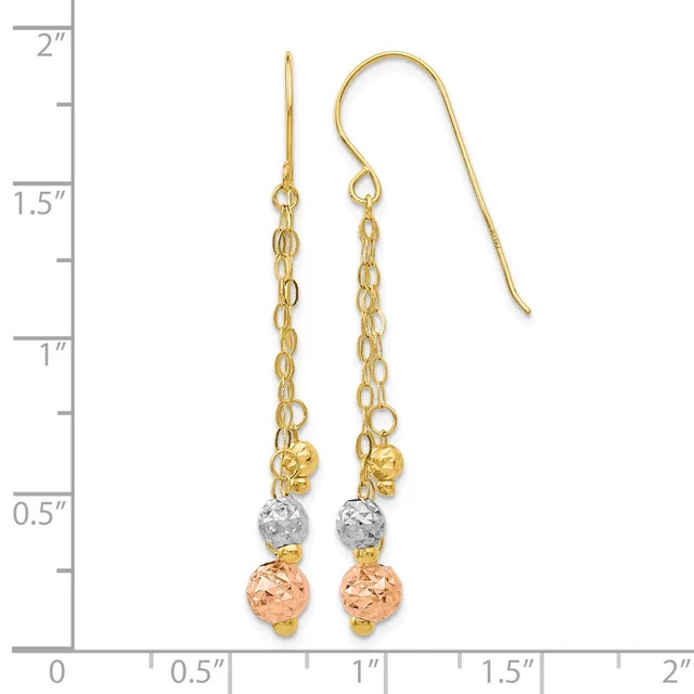 Pair of gold tricolor dangle earrings with chain and textured sphere beads, shown against a ruler measuring approximately two inches in length.