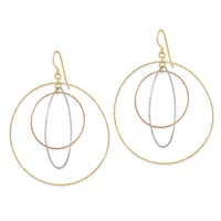 A pair of dangling earrings with triple concentric circles in gold, rose gold, and silver tones, suspended from gold ear wires.