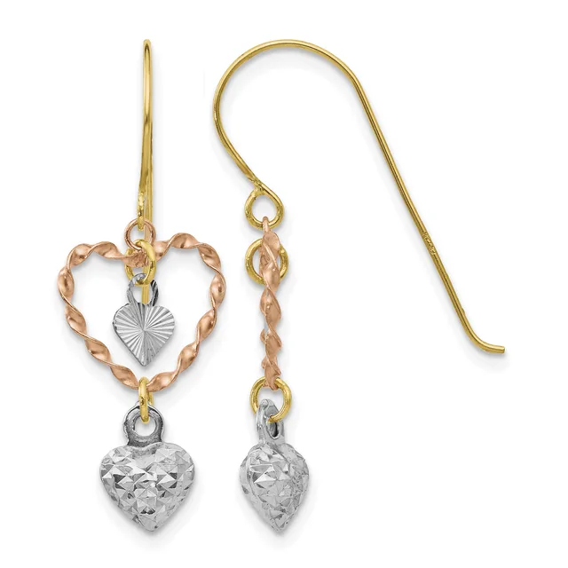 Pair of gold and silver two-tone heart dangle earrings with twisted rose gold frames, textured silver heart charms, and fish hook ear wires.