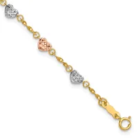 A tri-color gold bracelet with alternating textured heart charms in white, rose, and yellow gold connected by small gold links, featuring a lobster clasp closure.
