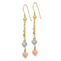 Pair of dangling earrings with gold fish-hook wires, textured gold spheres, chain links, silver textured heart beads, and rose gold textured heart charms.