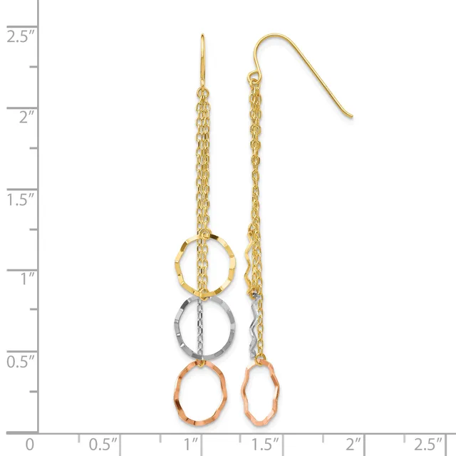 Gold chain dangle earrings with three stacked rings in gold, silver, and copper finishes, displayed next to a measurement ruler.