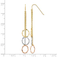 Gold chain dangle earrings with three stacked rings in gold, silver, and copper finishes, displayed next to a measurement ruler.
