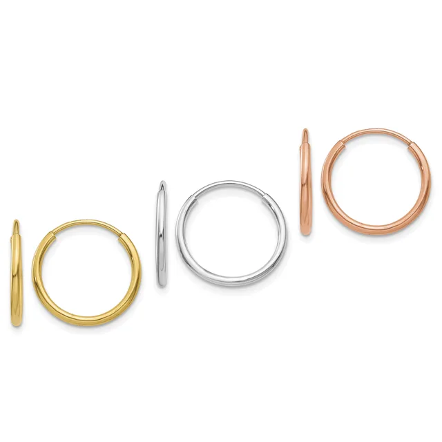 Three pairs of polished hoop earrings in yellow gold, white gold, and rose gold, displayed side by side showing varying sizes.