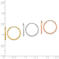 Five metal bangles in graduated sizes displayed against a ruler, ranging from approximately one inch to two and a half inches in diameter, in gold, silver, and rose gold finishes.