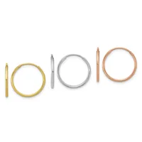 Six simple metal rings arranged in a row, including gold, silver, and rose gold circular and tubular bands of varying widths.