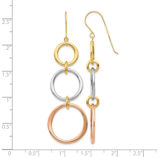 Pair of tricolor gold dangle earrings with three stacked rings in yellow, white, and rose gold, suspended from gold ear wires, displayed against a measurement scale.