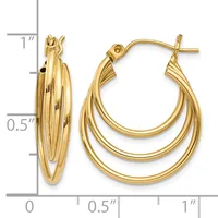 A pair of gold triple-layered hoop earrings with post and clutch closures, displayed next to a ruler showing approximately one inch in length.
