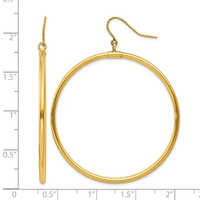 A pair of gold-toned hoop earrings with matching ear wires displayed next to a measurement ruler showing they are approximately two inches long.