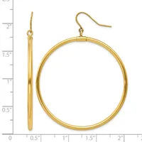 A pair of gold-toned hoop earrings with matching ear wires displayed next to a measurement ruler showing they are approximately two inches long.