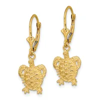 Pair of gold turtle charm earrings with textured shells and beaded details, suspended from lever-back hooks.