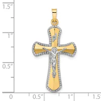 Two-tone gold crucifix pendant with white diamond accents around the border and a silver corpus Christi figure in the center, shown next to a measurement scale.