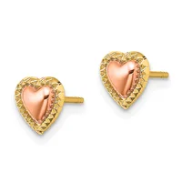 A pair of heart-shaped stud earrings with rose gold polished centers and textured yellow gold borders, displayed against a white background.