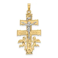 Two-tone gold crucifix pendant featuring a silver-toned corpus, decorative cross arms with text, two winged cherubs at the base, and a small lion head at the top.