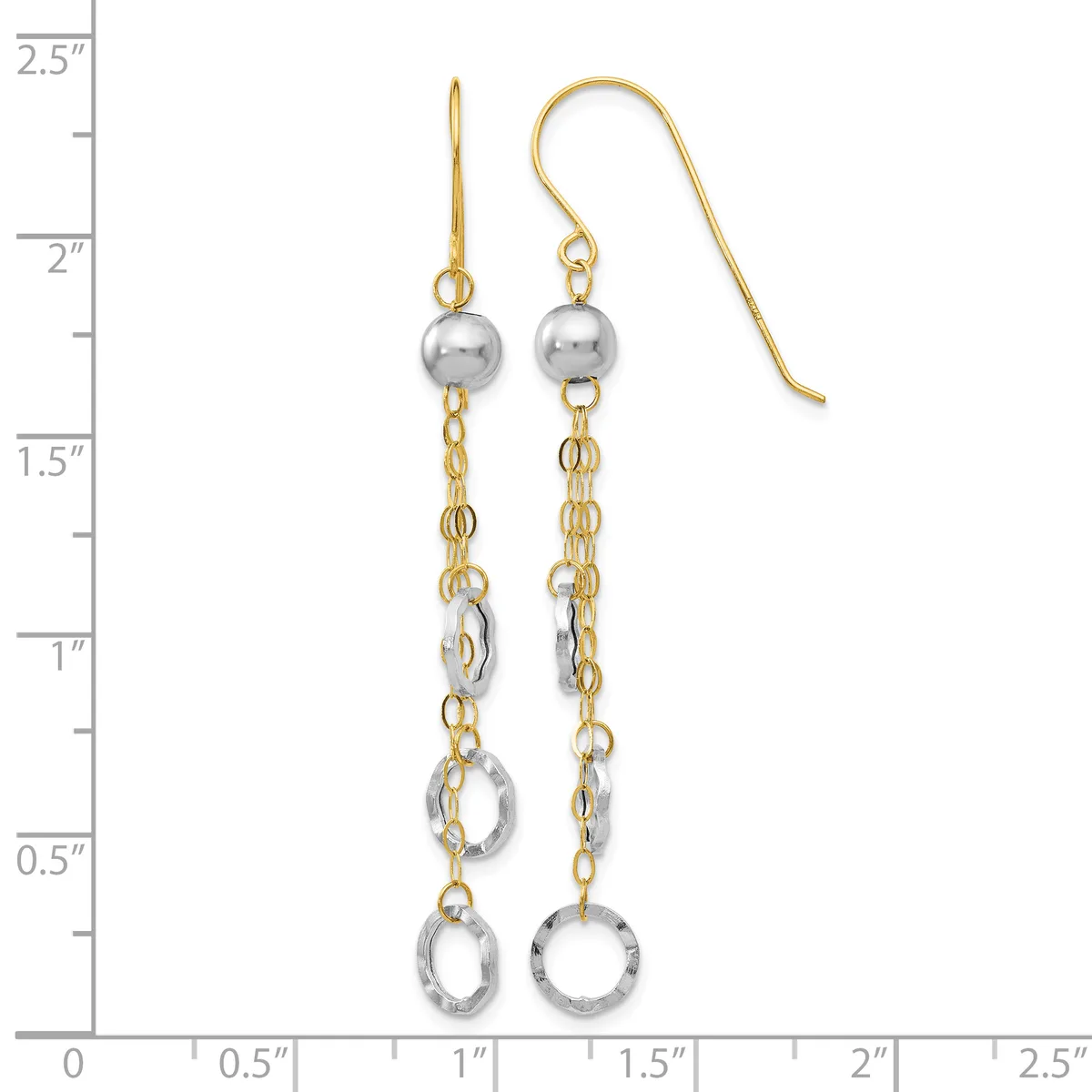 Pair of two-tone gold and silver dangling earrings with polished spheres at the top and textured circular charms at the bottom, displayed on a measurement scale.