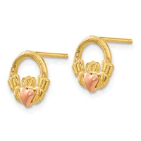 Pair of gold stud earrings with textured oval loops and rose gold heart charms held by decorative claddagh-style hands.