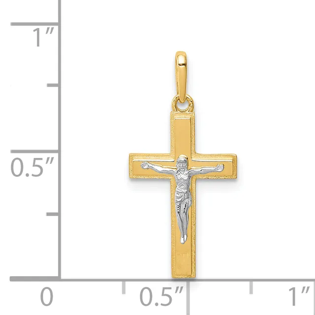 A gold cross pendant with a silver-toned crucifix figure in the center, shown next to a ruler indicating the pendant is approximately 0.75 inches wide and 1 inch tall.