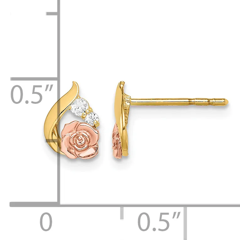 A pair of tricolor gold stud earrings featuring rose-shaped copper centers with diamond accents, displayed against a measurement scale.