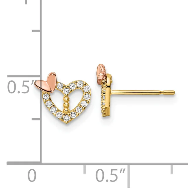 Gold heart stud earrings with diamond pavé setting and rose gold arrow accents, displayed against a measurement scale.