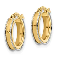 A pair of two-tone gold hoop earrings with polished yellow gold centers and textured white gold edges, shown from front and back views.