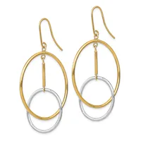 A pair of two-tone dangle earrings with gold oval outlines suspended over silver ovals, hanging from gold ear wires.