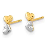 A pair of two-tone heart stud earrings featuring polished gold upper hearts and silver lower hearts on gold posts.