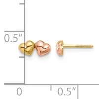 Two-tone heart stud earrings in yellow and rose gold with screw backs, shown against a measurement scale indicating approximately 0.5 inches in size.